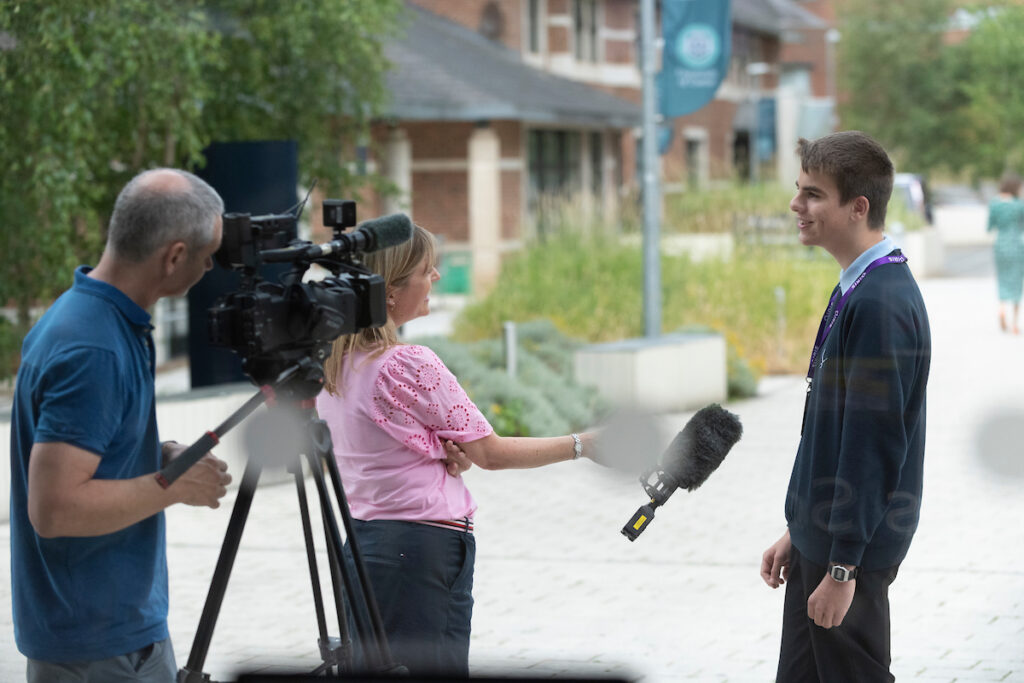 camera microphone boy interviewed